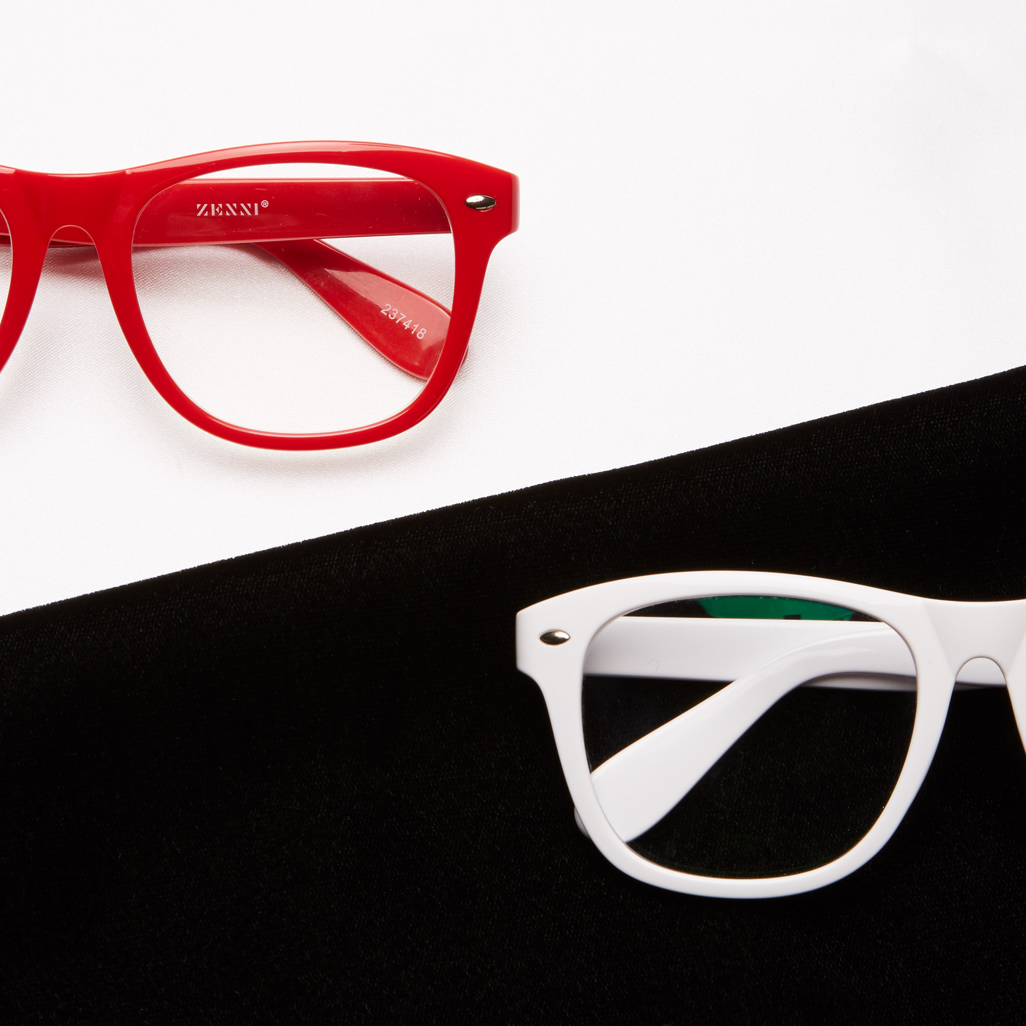 Red Zenni glasses with model number 204748 on the arm, next to white glasses on black and white background.