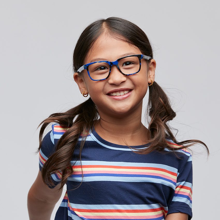 Child wearing blue eyeglasses and a striped blue shirt.