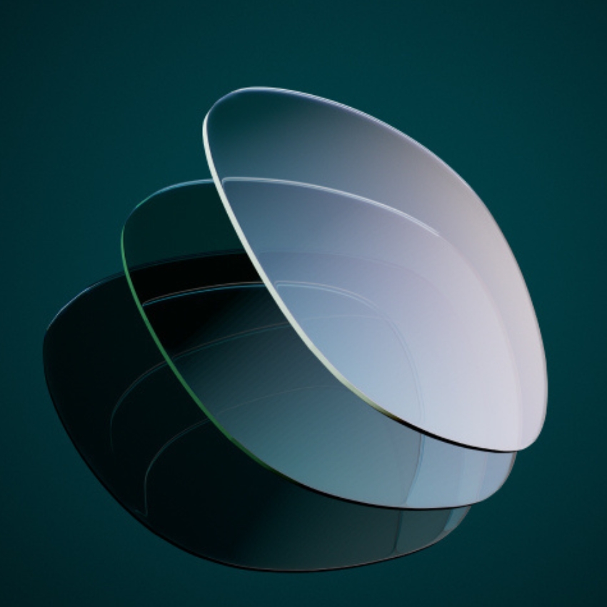 Three overlapping, concave, rectangular lenses with rounded edges, fading from dark to clear.